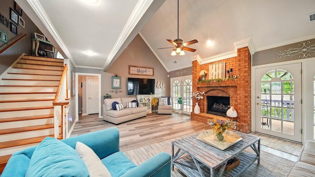 2458 Carrollwood Ln, Cordova, TN 38016 - living room featuring plenty of natural light, stairway, wood finished floors, crown molding, and high vaulted ceiling