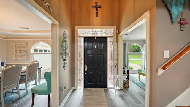 2458 Carrollwood Ln, Cordova, TN 38016 - entrance foyer featuring wood finished floors, baseboards, a towering ceiling, ornamental molding, and stairs