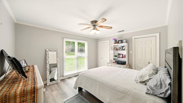 2458 Carrollwood Ln, Cordova, TN 38016 - bedroom featuring crown molding, light wood finished floors, a ceiling fan, and baseboards