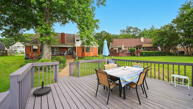 2458 Carrollwood Ln, Cordova, TN 38016 - wooden terrace featuring outdoor dining space and a lawn