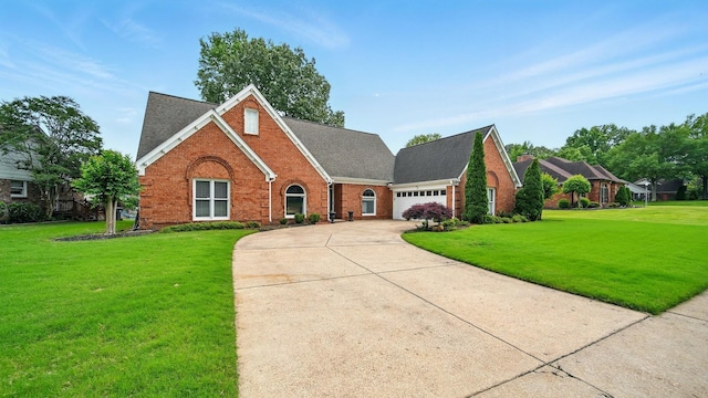 2458 Carrollwood Ln, Cordova, TN 38016 - traditional home featuring brick siding, an attached garage, a front lawn, and driveway