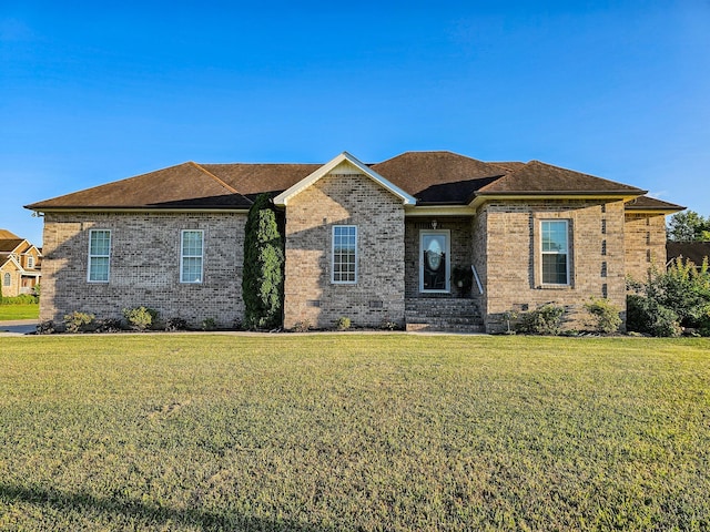 300 Woodson Dr, Tullahoma, TN 37388 - view of front of home with a front lawn and brick siding
