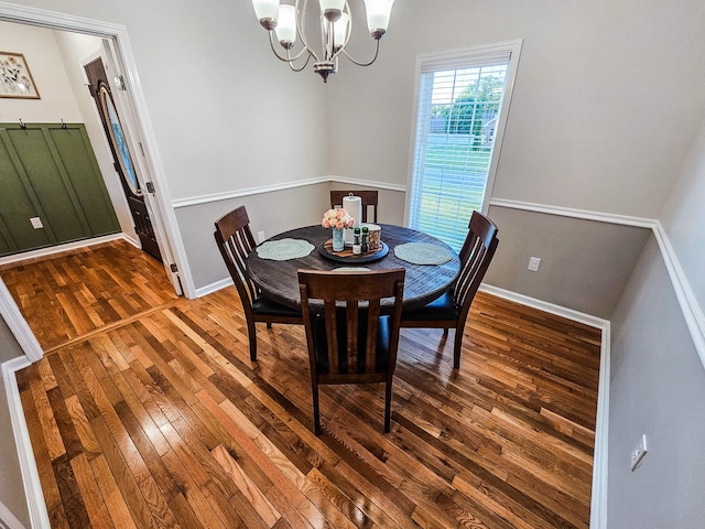 300 Woodson Dr, Tullahoma, TN 37388 - dining room with a chandelier, wood-type flooring, and baseboards