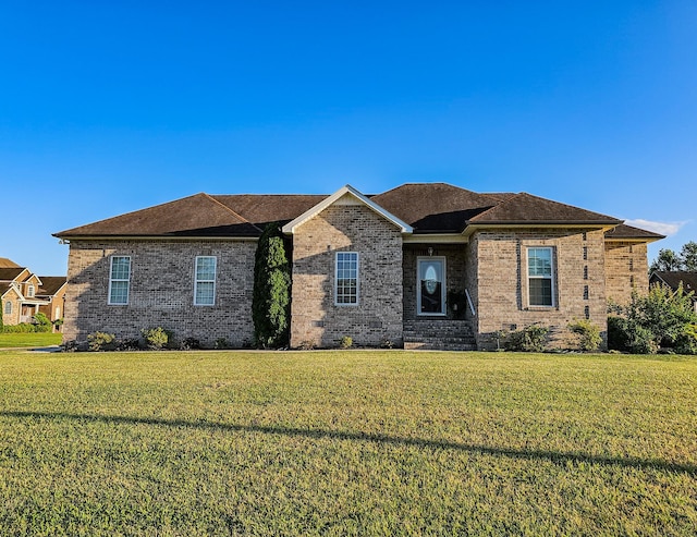 300 Woodson Dr, Tullahoma, TN 37388 - view of front facade featuring a front yard and brick siding