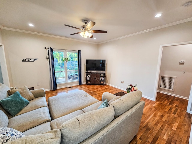 300 Woodson Dr, Tullahoma, TN 37388 - living area with ceiling fan, wood finished floors, baseboards, crown molding, and recessed lighting