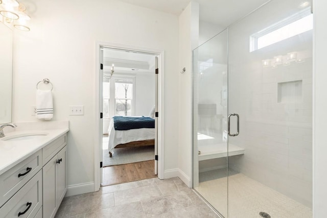 611 Lake Reserve Cv, Hermitage, TN 37076 - ensuite bathroom with vanity, plenty of natural light, a shower stall, and baseboards