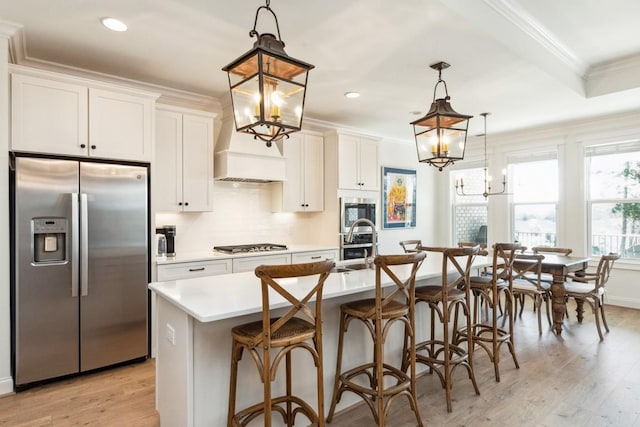611 Lake Reserve Cv, Hermitage, TN 37076 - kitchen featuring stainless steel appliances, a chandelier, light countertops, a kitchen island with sink, and recessed lighting