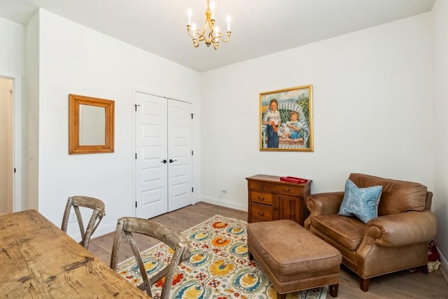 611 Lake Reserve Cv, Hermitage, TN 37076 - living area with a chandelier, wood finished floors, and baseboards