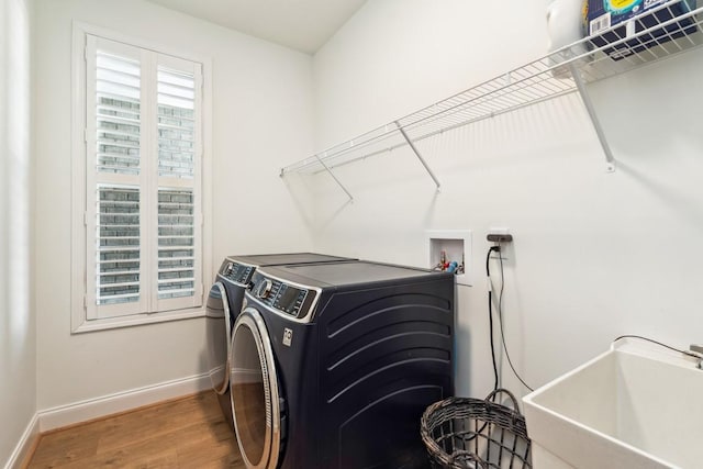611 Lake Reserve Cv, Hermitage, TN 37076 - washroom featuring washing machine and dryer, baseboards, and wood finished floors