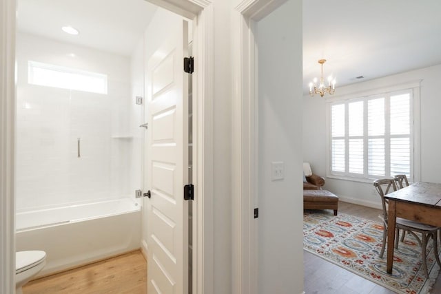 611 Lake Reserve Cv, Hermitage, TN 37076 - full bath with wood finished floors, a chandelier, toilet, shower / bath combination, and vanity