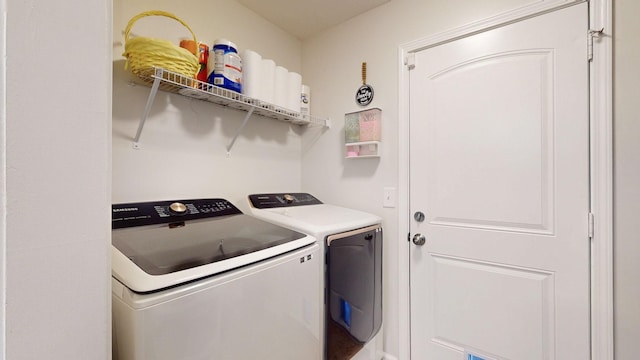1807 Mosley Ferry Rd, Chapmansboro, TN 37035 - washroom with washer and clothes dryer
