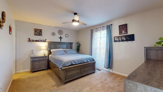 1807 Mosley Ferry Rd, Chapmansboro, TN 37035 - bedroom with light carpet, baseboards, and ceiling fan