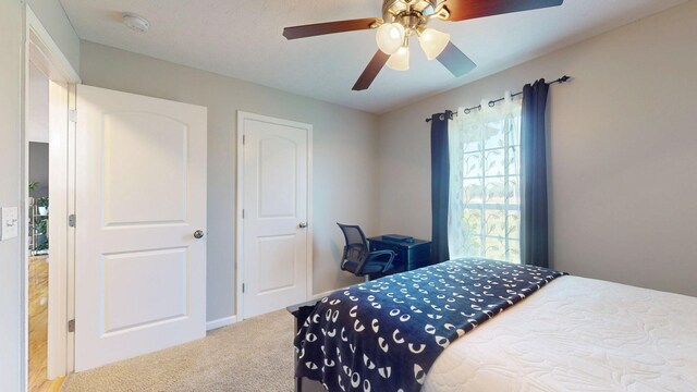 1807 Mosley Ferry Rd, Chapmansboro, TN 37035 - carpeted bedroom featuring ceiling fan