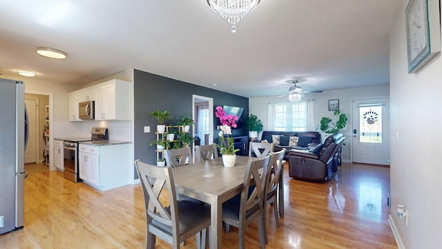 1807 Mosley Ferry Rd, Chapmansboro, TN 37035 - dining space with light wood-type flooring, a ceiling fan, and baseboards