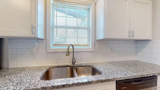 1807 Mosley Ferry Rd, Chapmansboro, TN 37035 - kitchen featuring dishwashing machine, a sink, white cabinetry, light stone countertops, and backsplash