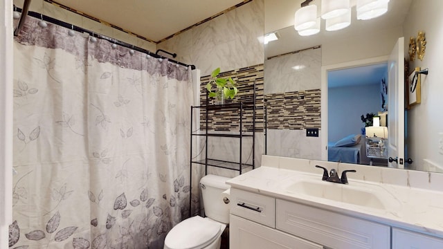 1807 Mosley Ferry Rd, Chapmansboro, TN 37035 - full bathroom featuring toilet, tile walls, vanity, and a shower with curtain