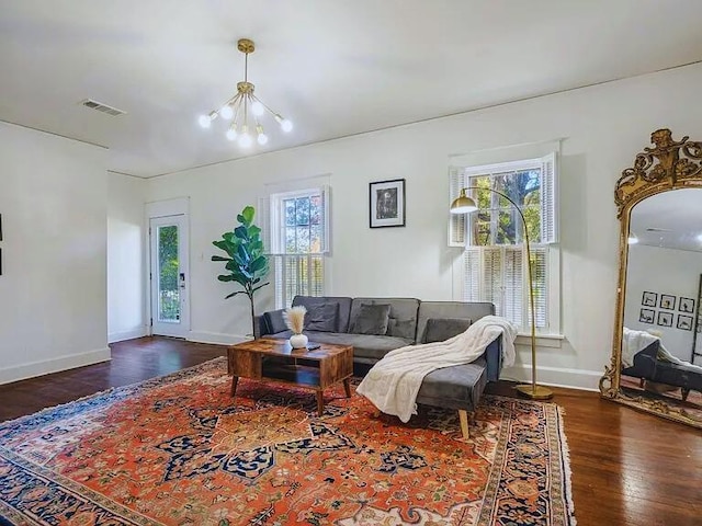 816 Charles Pl, Memphis, TN 38112 - living area with healthy amount of natural light, a chandelier, wood finished floors, and baseboards
