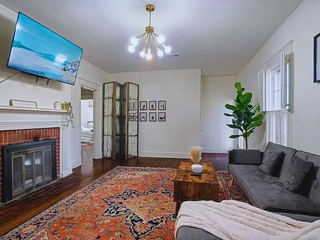 816 Charles Pl, Memphis, TN 38112 - living area with wood finished floors, a chandelier, a fireplace, and baseboards