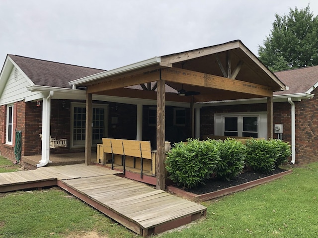 2026 Saundersville Ferry Rd, Mount Juliet, TN 37122 - back of house with brick siding, a wooden deck, and a yard