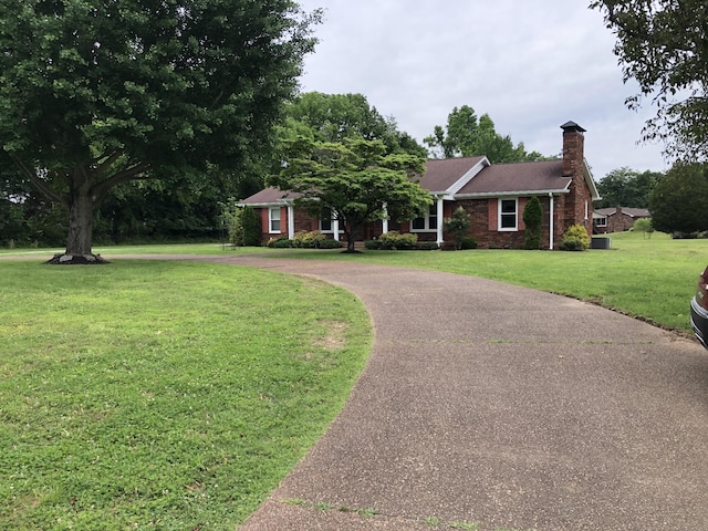 2026 Saundersville Ferry Rd, Mount Juliet, TN 37122 - single story home with curved driveway, a chimney, a front yard, and brick siding