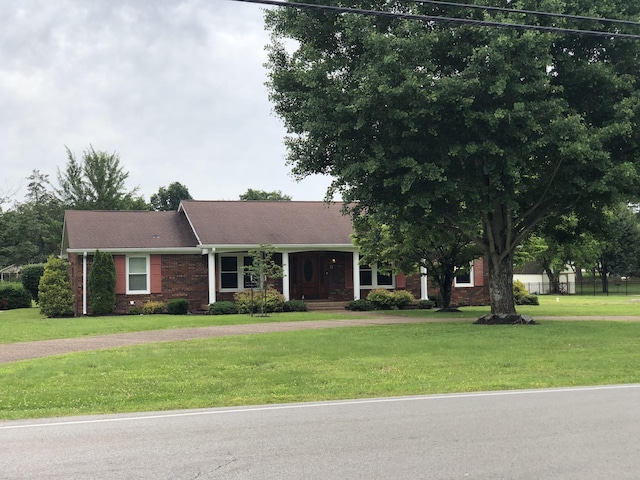 2026 Saundersville Ferry Rd, Mount Juliet, TN 37122 - view of front of home with a front yard and brick siding