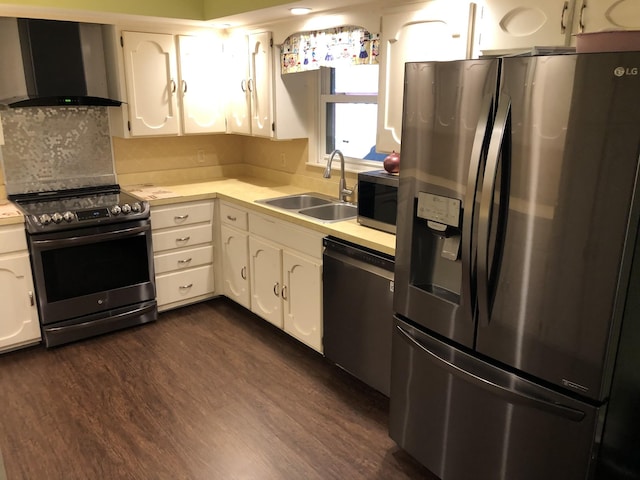 2026 Saundersville Ferry Rd, Mount Juliet, TN 37122 - kitchen with stainless steel appliances, wall chimney exhaust hood, a sink, light countertops, and dark wood-style flooring