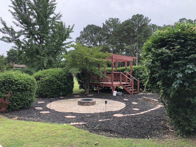 2026 Saundersville Ferry Rd, Mount Juliet, TN 37122 - view of yard featuring a fire pit, a pergola, a wooden deck, and a patio