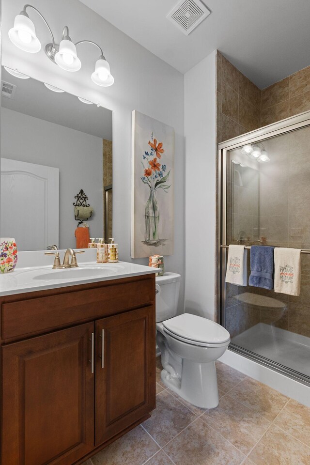 1763 Humphreys Gln, Spring Hill, TN 37174 - full bathroom with vanity, toilet, a shower stall, and tile patterned floors
