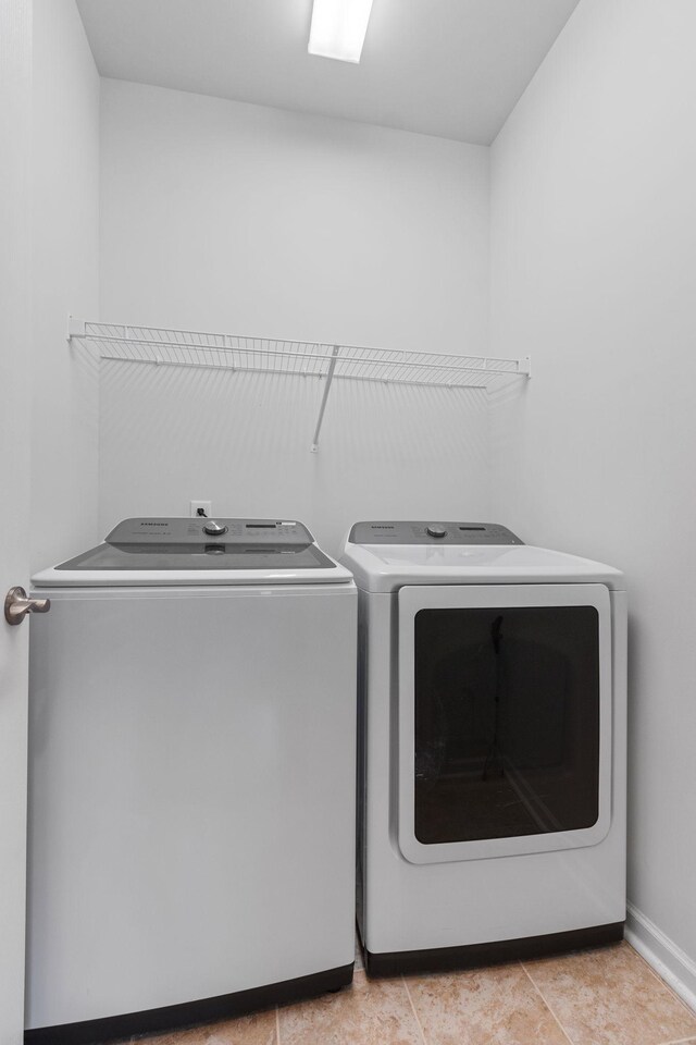 1763 Humphreys Gln, Spring Hill, TN 37174 - washroom featuring washing machine and clothes dryer and baseboards