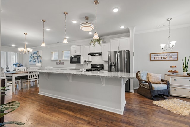 1763 Humphreys Gln, Spring Hill, TN 37174 - kitchen with a chandelier, black appliances, ornamental molding, a breakfast bar area, and white cabinetry