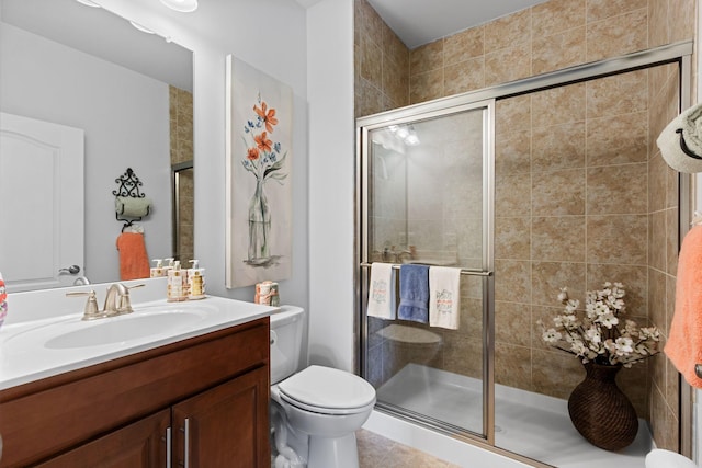 1763 Humphreys Gln, Spring Hill, TN 37174 - bathroom featuring a stall shower, vanity, toilet, and tile patterned flooring