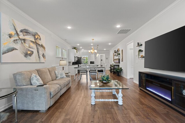 1763 Humphreys Gln, Spring Hill, TN 37174 - living room featuring ornamental molding, a chandelier, dark wood-type flooring, recessed lighting, and baseboards