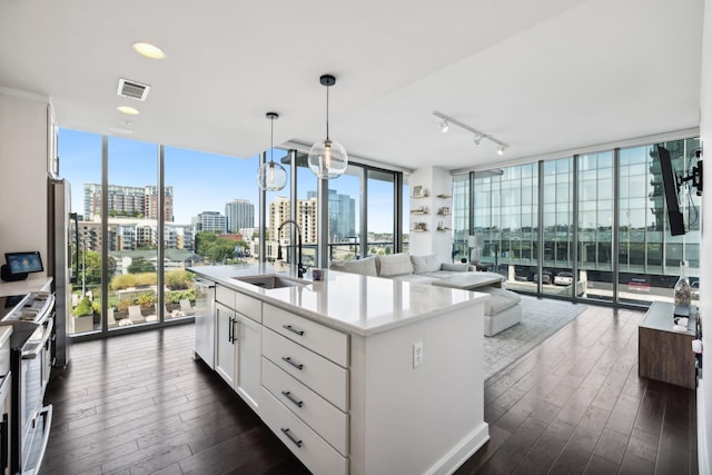 1212 Laurel St Unit 615, Nashville, TN 37203 - kitchen featuring a sink, expansive windows, stainless steel appliances, a city view, and healthy amount of natural light