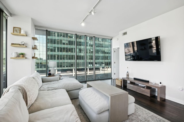 1212 Laurel St Unit 615, Nashville, TN 37203 - living area featuring floor to ceiling windows, wood finished floors, and rail lighting