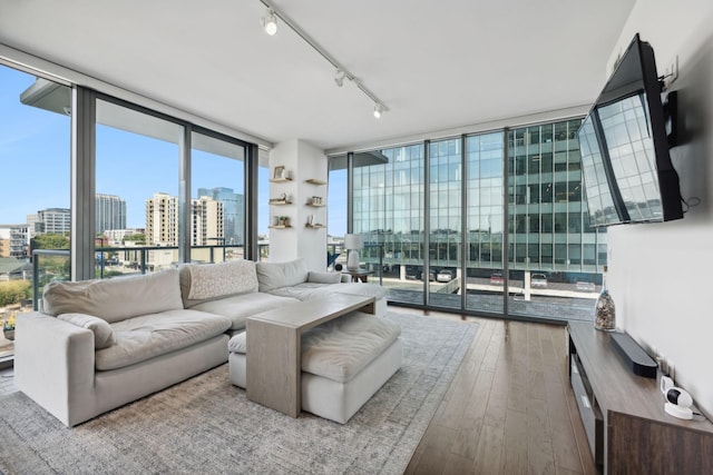 1212 Laurel St Unit 615, Nashville, TN 37203 - living area with floor to ceiling windows, a city view, rail lighting, and hardwood / wood-style flooring