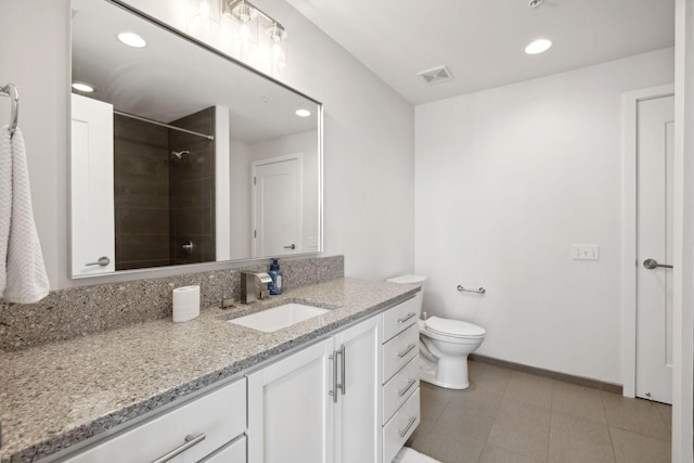 1212 Laurel St Unit 615, Nashville, TN 37203 - bathroom featuring vanity, tiled shower, recessed lighting, toilet, and baseboards