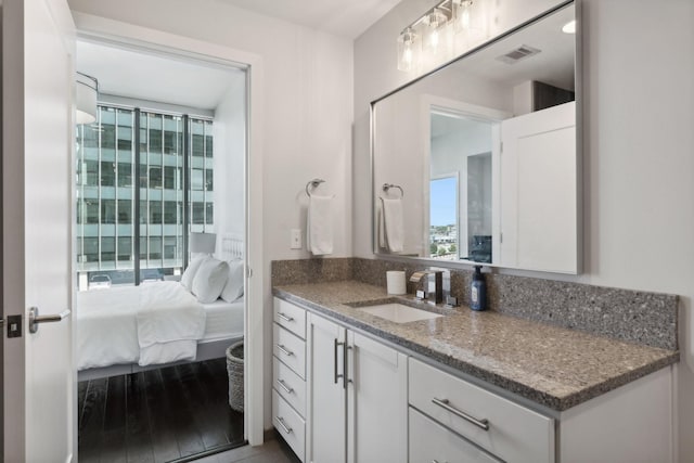 1212 Laurel St Unit 615, Nashville, TN 37203 - bathroom featuring vanity and wood finished floors