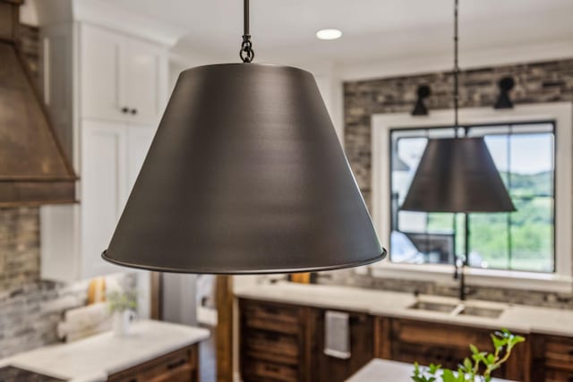3166 Tanyard Hollow Rd, Culleoka, TN 38451 - kitchen view of white cabinetry, backsplash, pendant lighting, light countertops, and recessed lighting