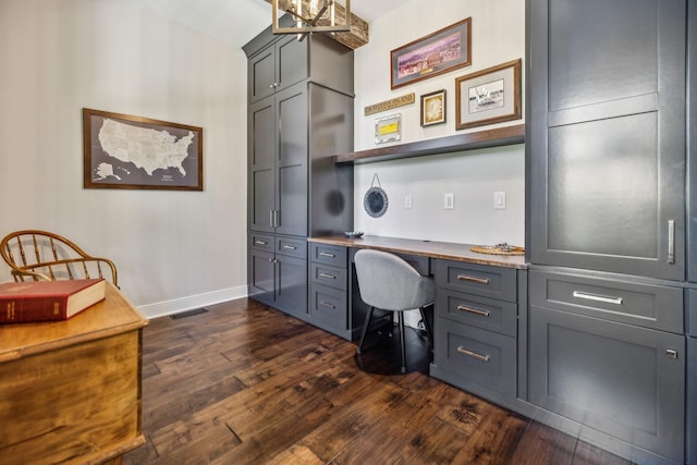 3166 Tanyard Hollow Rd, Culleoka, TN 38451 - office space with dark wood-style floors, built in desk, and baseboards
