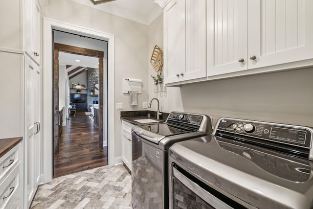 3166 Tanyard Hollow Rd, Culleoka, TN 38451 - laundry area with washer and dryer, cabinet space, and ornamental molding