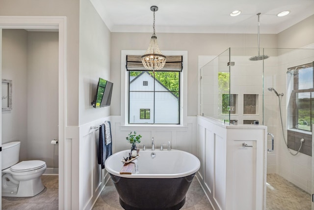 3166 Tanyard Hollow Rd, Culleoka, TN 38451 - bathroom with a shower stall, a freestanding bath, toilet, a decorative wall, and wainscoting
