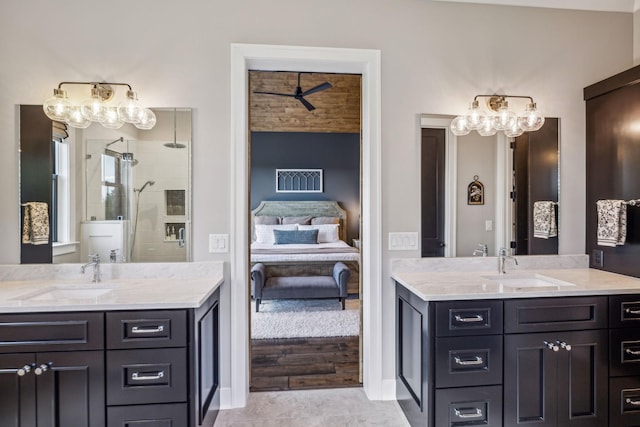 3166 Tanyard Hollow Rd, Culleoka, TN 38451 - ensuite bathroom featuring two vanities, a shower stall, ceiling fan, and baseboards