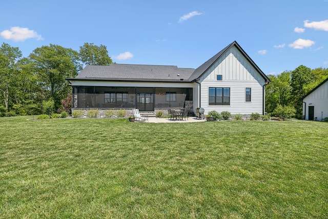 3166 Tanyard Hollow Rd, Culleoka, TN 38451 - back of property featuring board and batten siding, a lawn, and a patio area