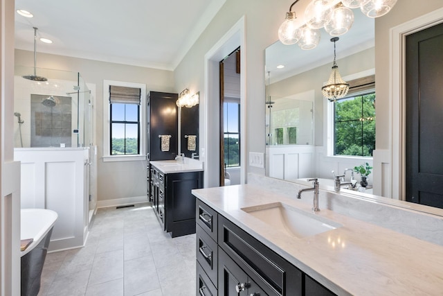 3166 Tanyard Hollow Rd, Culleoka, TN 38451 - full bathroom with a chandelier, a stall shower, two vanities, a soaking tub, and ornamental molding