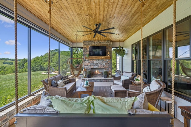 3166 Tanyard Hollow Rd, Culleoka, TN 38451 - sunroom / solarium featuring ceiling fan and an outdoor living space with a fireplace