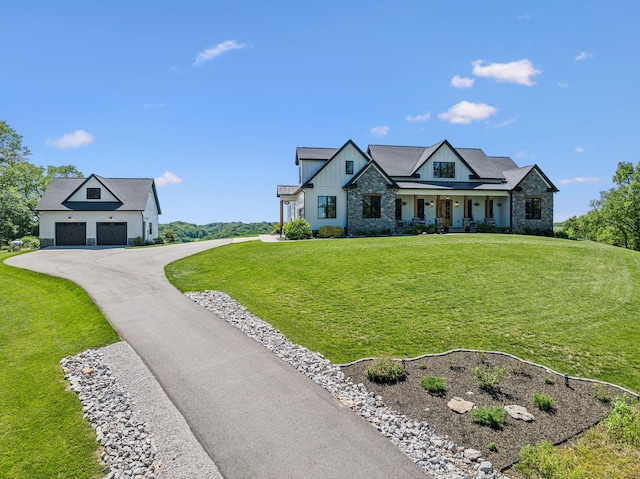 3166 Tanyard Hollow Rd, Culleoka, TN 38451 - modern inspired farmhouse featuring a front lawn, board and batten siding, driveway, a garage, and a standing seam roof