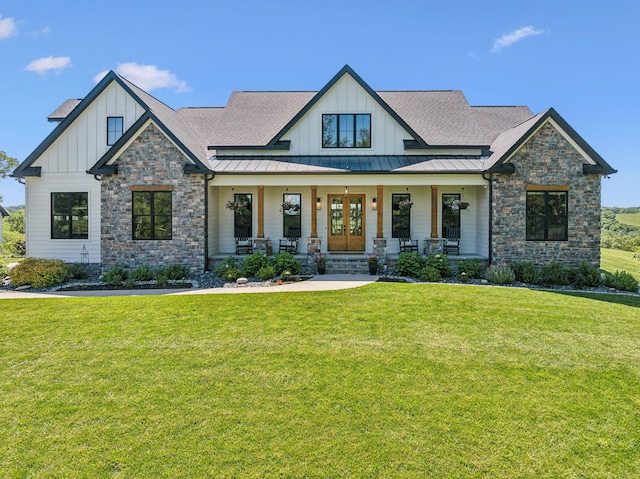 3166 Tanyard Hollow Rd, Culleoka, TN 38451 - view of front of house featuring board and batten siding, stone siding, and a front yard