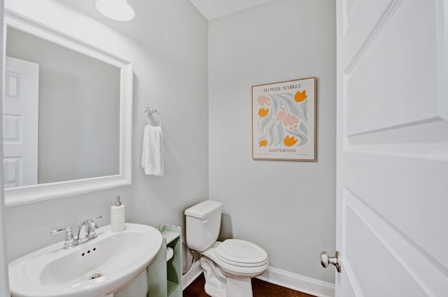 3227 Vinemont Dr, Thompsons Station, TN 37179 - half bathroom with a sink, toilet, and baseboards