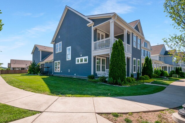 3227 Vinemont Dr, Thompsons Station, TN 37179 - view of home's exterior with a balcony, a lawn, and a residential view
