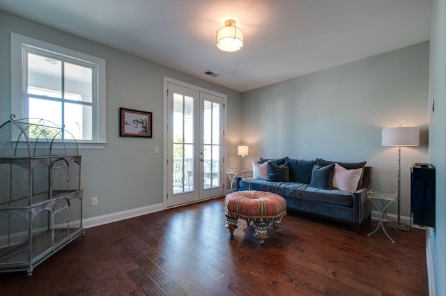 3227 Vinemont Dr, Thompsons Station, TN 37179 - living area with french doors, wood finished floors, and baseboards